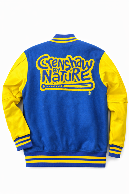 Crenshaw by Nature varsity jacket detail — gold vegan leather sleeves with embroidered CBN sleeve hit and gold snap-front hardware